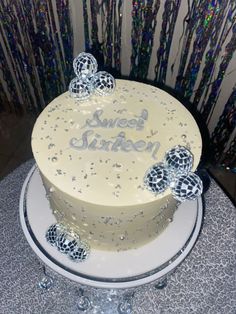 a white cake sitting on top of a table