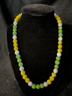 Grab this custom Green and Yellow Sprite inspired colorway. Beaded Rhinestone Necklace Blinged Out!   20in w/ magnetic clasp ️️ Elevate your style AND your game with our vibrant, handcrafted beaded necklace.   Look Good, Feel Good, Feel Good Play Good! BLING BLING ⚾️🏈⚽️🏀⚾️️ 📿 Baseball Football Soccer Softball Basketball 🌟 Features: Blinging & Bursting with Co:lor: A symphony of dazzling, handpicked beads in every hue imaginable - from vivid greens to vibrant yellow! 🌟 Unique Design 💎 Quality Matters: Thick Elastic band and screw on clasps ensure durability and long-lasting wear. 🌟 Versatile Wear: Perfect for all sports fields😎, beach days, date nights, or simply adding a pop of personality to your everyday look. A conversation piece. 📸 Instagram-Ready: Be prepared for compliments Bling Round Beads Necklace For Gift, Gift Necklaces With Bling And Round Beads, Gift Bling Round Beads Necklaces, Silver Beaded Necklaces With Rhinestones, Silver Beaded Necklace With Rhinestones, Gift Round Beads Bling Necklace, Multicolor Round Beads Jewelry With Rhinestones, Multicolor Beaded Rhinestone Necklace For Gift, Gift Rhinestone Beaded Necklaces