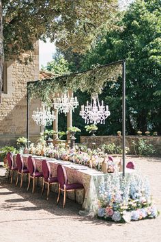 Crystal Chandeliers on portal structure, on pathway to ceremony area, above cake table. Chandelier Arbor Wedding, Arch With Chandelier Wedding, Chandelier Wedding Ceremony, Chandelier Over Table Wedding, Free Standing Chandelier Wedding, Wedding Arch Chandelier, Wedding Outdoor Chandelier, Vintage Event Decor, Crystal Chandelier Wedding Decor