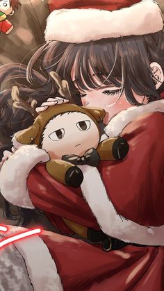 a woman in a santa hat hugging a child