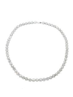 Highest quality, crystal clear cubic zirconia stones in a halo setting, set in a sterling silver tennis necklace that will stun with its sparkle and clarity. Truly a spectacular piece, for a special occasion! 17" long, comprised of a total of 912 stones. Interior setting stones are 4mm in diameter. Safety clasp. Imported by Italian Ice Dazzling Rhinestone Round Tennis Necklace, Dazzling Rhinestone Tennis Necklace, Elegant Round Tennis Necklace With Rhinestones, White Gold Rhinestone Tennis Necklace, White Gold Tennis Necklace With Rhinestones, Dazzling Cubic Zirconia Round Cut Tennis Necklace, Dazzling Cubic Zirconia Tennis Necklace Round Cut, Classic Crystal Tennis Necklace With Rhinestones, Rhinestone Tennis Necklace