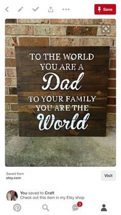 a wooden sign that says to the world you are a dad to your family you are the world