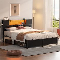 a bed sitting on top of a hard wood floor next to a chair and window