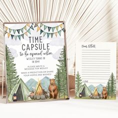 two camping themed stationery cards with bears and tents in the woods, on top of a wooden table