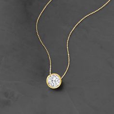 Ross-Simons - 1.20ct Bezel-Set Diamond Solitaire Necklace in 14kt Yellow Gold. 20". Utterly classic, this diamond necklace is a wardrobe essential. A marvelous 1.20 carat bezel-set round brilliant-cut diamond glows from polished 14kt yellow gold on a sleek box chain. Will add timeless diamond shimmer to your elegant everyday ensembles. Springring clasp, diamond necklace. Diamond birthstones are the perfect gift for April birthdays. Classic Diamond Necklace With Bezel Setting, Classic Diamond Necklace With Bezel Setting For Everyday Luxury, Classic Diamond Necklace For Anniversary With Bezel Setting, April Birthday, Diamond Birthstone, Diamond Solitaire Necklace, Solitaire Necklaces, Bezel Set Diamond, Bezel Diamond