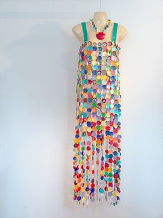 a dress made out of buttons and beads