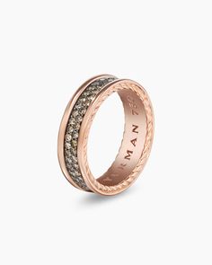 an 18k rose gold ring with brown and white diamonds, set in two bands