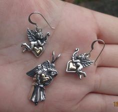 ********This sterling silver angel Earrings measure:1-1/4" from the top of the earwire to the bottom of the angel.Width of the angel at the widest part is almost 3/4" or 31mm x 18mmThe heart is gold filled.Price is for the pair of earrings at $21.95******** This Sterling Silver Angel pendant measures: just over 1-1/4"(from top of the angel to the bottom) x 5/8" at the widest part. or 33mm x 19mmThe heart is gold filled.Price is for one pendant at $18.95******************************************* Angelic Sterling Silver Jewelry For Gifts, Silver Angelic Jewelry For Gift, Angelic Silver Jewelry For Gift, Silver Pendant Earrings For Valentine's Day, Angel Earrings, Angel Pendant, What Is Advertising, The Angel, Printing Labels