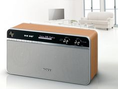 an old style radio sitting on top of a white table