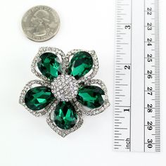 Gorgeous emerald green brooch jewelry embellishment, which can be used for your DIY project - Emerald wedding, bridal sash, cake and frame decorations, pillow and clutch decor, crafts, scrap booking and much more. Size: 1 3/4 inches wide 1 3/4 inches high Stones color: Crystal clear and emerald green Metal: Silver plated This rhinestone green broach can be ordered with pin in the back to add to wedding gown or dress sash, to wire into brooch bouquet, or any number of other craft projects; or wit Green Crystal Brooch Jewelry, Green Rhinestone Wedding Brooch, Green Rhinestone Wedding Brooches, Elegant Green Rhinestone Brooches, Green Wedding Brooches, Women Green Dress, Wedding Brooches, Green Brooch, Green Cake