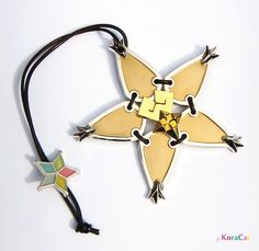 an ornament is attached to a cord with a star shaped design on it