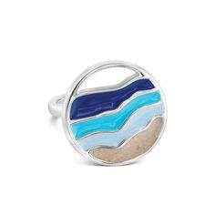 Make a splash with the Hues of Blue Cocktail Ring. The ocean's vibrant movement unfolds across your finger with mesmerizing swirls of turquoise, sapphire, and cerulean. Each ring holds a unique treasure - your chosen sand or earth element, a tangible reminder of moments spent under the sky or beside the sea. Let your adventures and dreams sparkle on every occasion. .925 Sterling Silver Hues of Blue Enamel Available in whole sizes 7, 8 & 9 Handmade with Love & Sandy Hands in the USA® Main photo shown is handmade with beach sand from St. Pete Beach, Florida Blue Polished Enamel Ring, Blue Enamel Polished Round Ring, Blue Enamel Ring With Polished Finish, Blue Enamel Ring With Polished Finish As Gift, Blue Enamel Ring With Polished Finish For Gift, Elegant Blue Enamel Sterling Silver Ring, Elegant Blue Enamel Ring In Sterling Silver, Blue Polished Open Ring Jewelry, Blue Sterling Silver Open Ring