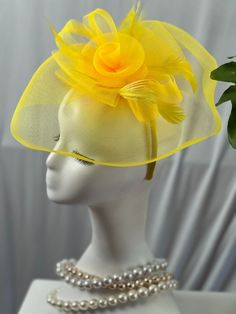 Step into style with our enchanting yellow Fascinator Hat, the ultimate statement piece for any sophisticated soiree. Crafted with the utmost care, this hat exudes elegance and is guaranteed to turn heads at any event. The vibrant yellow hue symbolizes warmth, joy, and positivity, making it a perfect companion for Derby days, church services, weddings, and even royal tea parties. The whimsical floral design adds a touch of grace and femininity, while the lightweight mesh ensures it's as comforta Gold Mini Hat For Evening In Spring, Gold Mini Hat For Spring Evening, Gold Mini Hat For Spring Evenings, Gold Party Hats For Spring, Gold Summer Fascinator, Gold Fascinator For Spring Evening, Gold Mini Hats For Summer Party, Adjustable Yellow Headpiece For Summer, Adjustable Yellow Headpieces For Summer