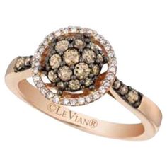 a brown and white diamond ring with the name oleevar on it's side