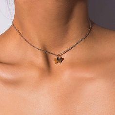 The most beautiful and delicate butterfly necklace is made to help guide you through your own rebirth and transformation. Wear out Butterfly Necklace to remind you that hope is alive and well and anything is possible. Pair this necklace with our best selling Butterfly Choker Necklace or your favorite gold chain for a fun layered look. DETAILS & SIZE Composition: 14k gold or silver plated over copper Measurements: pendant: 10mm, chain: 20" extension Lobster claw clasp Read about how to care f Shifting Visuals, Chain Butterfly, Butterfly Choker, Minimalist Necklace Gold, Butterfly Necklace Gold, Delicate Butterfly, Necklace Elegant, Butterfly Pendant Necklace, Butterfly Jewelry