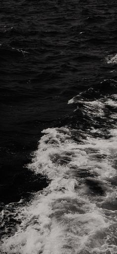 black and white photograph of waves in the ocean