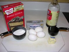 ingredients for cake sitting on top of a counter next to a bottle of milk and an egg