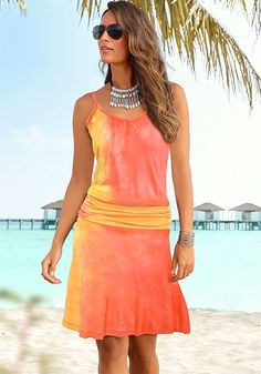 This casual fit dress is ideal for sunny getaways. Casual Sundress For Summer, Chic Orange Sundress For Beach Season, Casual Multicolor Dress For Beach Party, Vacation Sundress Midi Length, Casual Sleeveless Midi Dress For Vacation, Casual Midi-length Sleeveless Dress For Vacation, Summer Midi Sundress For Beach Season, Orange Sleeveless Dress For Beach Vacation, Orange Sundress Mini Dress For Beach