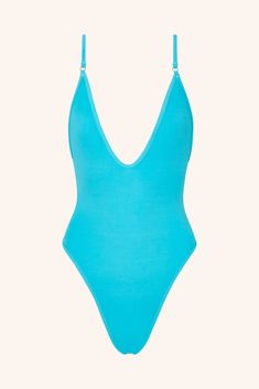 It’s our most iconic turquoise one-piece swimsuit. Whether you're making waves or catching them, this stunning swimsuit with a plunging neckline in a vibrant turquoise shade delivers confidence with every splash. More than just swimwear – it’s a bold fashion statement. Cut & Fit Shaping, sculpting fit Pulls on Plunging neckline High-cut style with medium coverage brief Hardware & Straps All gold hardware Adjustable shoulders straps Lining & Fabric Double-lined  84% polyamide, 16% ela Swimwear Design, Gold One Piece, Grey One Piece, Brown One Piece, Purple One Piece, Green One Piece Swimsuit, Green One Piece, Red One Piece, Blue One Piece Swimsuit