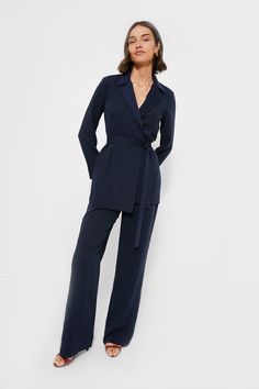 Polished and chic, the Navy Octavia Wrap Blazer comes with a chic self-tie waist, lapel collar, and longer hem, this number is a necessity. Pair it with the matching Navy Erin pants for a summer power suit moment, or with a mini skirt and heels for drinks and dinner. Lapel collar Long sleeves Removable self-tie belt (included) Straight hem Lined Material: 96% Polyester, 4% Spandex (body), 97% Polyester, 3% Spandex Care: Machine wash cold and gentle, tumble dry low, iron low Wrap Blazer, Hamptons Summer, Summer Style Guide, Navy Suit, Plus And Minus, Power Suit, The Navy, Low Iron, Lapel Collar