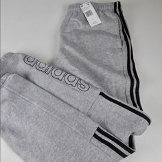 Adidas Joggers Jogger Style Sweatpants Elastic Waistband Interior Drawstring 3 Stripe Design Side Hand Pockets Fleece Lining Adidas Branding On Leg Jogger Style Leg Opening Approximate Measurements: Inseam About 30.5” Waist Across Front (Elastic So Flexible +/-1”) S: 14.5”. M: 15.5”. L: 16.5”. Xl: 18”. Xxl: 19.5” Brand New With Tags Pricing Is Fair And Quite Firm . Please Let Us Know If You Have Any Questions. Red Adidas Pants, Adidas Fleece, Basketball Pants, Adidas Sweats, Adidas Branding, Pants Adidas, Style Sweatpants, Adidas Classic, Adidas Joggers