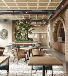 an empty restaurant with wooden tables and blue chairs in front of a plant on the wall