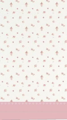 a pink and white wallpaper with small flowers on the bottom half of it,