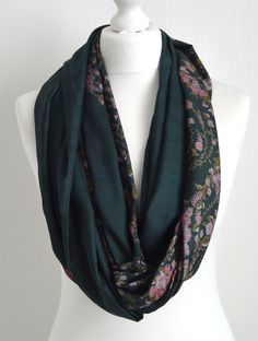 "This stunning eco friendly green and pink floral infinity scarf has been sewn from a vintage silk blend sari's to make a lovely, simple to wear accessory: just wrap it twice or three times around your neck, or fold in half & slip one end through the other - a versatile accessory of generous proportions. The natural, breathable silk means it will keep you warm in the winter but won't be too hot for the summer. The scarf is made from a double layer of fabric which is sewn into a loop with all Green Shawl Scarves For Festive Occasions, Green Shawl Scarf For Festive Occasions, Green Festive Shawl Scarf, Festive Bohemian Green Shawl, Traditional Green Winter Scarf, Festive Green Shawl Scarf, Festive Green Silk Shawl, Festive Green Bohemian Scarves, Green Pashmina Scarves For Winter