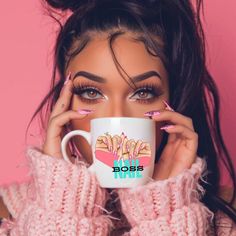 a woman holding a coffee mug with her hands on her face and looking at the camera