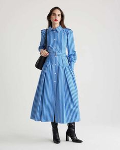 The maxi shirtdress in victoria blue stripes is a button front striped dress featuring a full volume tiered skirt shirt collar shoulder tabs and jp-engraved mother of pearl buttons.    -   raglan sleeves  - removable belt at the waist with gold-tone buckle.  - 100% bci cotton  - made in madagascar Spring Striped Collared Dress, Striped Long Sleeve Maxi Dress For Daywear, Striped Long Sleeve Maxi Dress For Work, Long Sleeve Dresses With Vertical Stripes For Work, Long Sleeve Vertical Stripes Work Dress, Long Sleeve Vertical Stripe Work Dresses, Spring Striped Midi Shirt Dress, Spring Shirt Dress With Striped Collar For Work, Striped Long Sleeve Midi Dress For Work