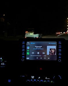 the dashboard of a car at night time