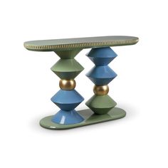 a green table with two blue and gold balls on the top, sitting in front of a white background