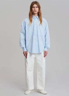 Color: Blue Crisp cotton poplin Oversized fit Pointed collar Double breast pockets Curved hem Button front closure Button cuffs 100% Cotton Dry Clean Imported One Size Product Measurements: 23" Shoulder 57" Chest 31" Length Model is 187cm/ 6'1" wearing size M Oversized Shirt, Cotton Poplin, Oversized Fits, Double Breasted, Color Blue, Dry Clean, Collar, How To Wear, Blue