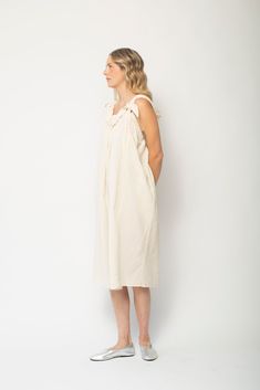 A dreamy new frock for sun drenched days, in a featherweight crinkle cotton. Tie front detail for an adjustable neckline. A breezy silhouette to live in all summer long. 100% Cotton imported from Japan Tie front detail on straps Straight neckline and elasticated back and midi length Made in the USA Machine wash gentle cycle or Hand wash & Tumble dry low Sleeveless Ruffled Linen Dress For Daywear, Flowy Linen Sundress For Daywear, Breezy Ruffled Sundress For Daywear, Daywear Linen Dress With Ruffles, Casual Cotton Voile Dresses For Daywear, Summer Cotton Voile Dresses For Daywear, Summer Linen Dress With Adjustable Straps, Bohemian Sundress With Adjustable Straps For Daywear, Summer Sundress With Ruffled Straps For Daywear