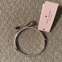 New With Tags! Cute Bow Design With Easy To Open Clasp Adjustable Metal Bracelet By Kate Spade, Silver Kate Spade Bangle Bracelet, Trendy Kate Spade Bracelet, Chic Adjustable Kate Spade Jewelry, Spring Gift Jewelry By Kate Spade, Kate Spade Bracelet, Cute Bow, Spade Jewelry, Kate Spade Jewelry