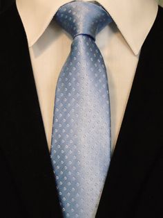 "This is a classic 100% silk light Blue Tie. This light blue necktie is also available as a extra long Tie. Handmade from 100% silk, this special collection features a .75\" Eds Neckties logo at the bottom right front corner of every tie and a larger logo located on the tipping (Back of the tie). The label features the collection name (Nathaniel Alexandria) Named after my son Nathaniel and my daughter Alexandria. Expertly hand-made from 100% silk you can select your length from 57\" to 63\" (Gre Classic Blue Ties For Business, Classic Blue Business Ties, Classic Blue Neckwear For Business, Classic Blue Business Neckwear, Elegant Light Blue Tie For Black Tie Events, Classic Blue Neckwear For Semi-formal Occasions, Elegant Light Blue Formal Ties, Elegant Light Blue Tie For Formal Occasions, Classic Light Blue Formal Ties