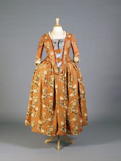 Robe à la française, ca. 1745. | Orange floral bodice and skirt banded together with golden ribbon. Internal burgundy tie strings. Stomacher sides lined with red ribbon tape. Italian, ca. 1745. Transferred from the Allen Memorial Art Museum, Oberlin College, Oberlin Ohio, KSUM 1995.17.66. 18th Century Womens Fashion, 1700 Fashion, 18th Century Women, Golden Ribbon, Burgundy Tie