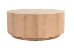 a round wooden table sitting on top of a white floor