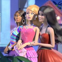 three barbie dolls standing next to each other