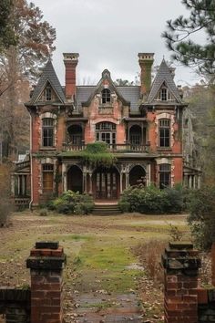 an old abandoned house with ivy growing on the roof and windows, surrounded by trees