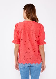 An ultra-pretty bohemian button-front blouse with short puff sleeves and a high ruffled neckline. Embroidered eyelet Relaxed fit Short puff sleeve Ruffled elastic cuff High ruffled neckline Button-front Not lined Bohemian blouse Embrace the warm summer days in this unlined style! The perfect day-to-night blouse adorned with an intricate embroidered eyelet detailing. Our simple yet sophisticated cotton top features feminine puff sleeves, a high ruffled neckline, and a functional button front. Try Feminine Short Sleeve Peasant Top For Daywear, Spring Short Sleeve Peasant Top For Daywear, Relaxed Fit Puff Sleeve Top For Spring, Spring Short Sleeve Peasant Top With Ruffles, Spring Eyelet Blouse With Relaxed Fit, Spring Broderie Anglaise Short Sleeve Blouse, Bohemian Broderie Anglaise Short Sleeve Blouse, Bohemian Blouse With Broderie Anglaise Short Sleeves, Casual Eyelet Blouse For Daywear