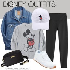 a woman in grey shirt and black pants wearing mickey mouse outfit