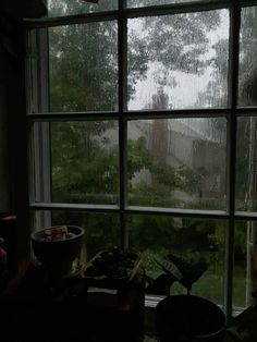 a window with rain coming in from the outside