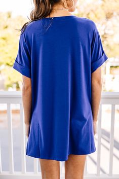 This versatile v-neck tee is here to make your life easy! It's honestly the perfect top for year round styling and layering. You can knot the hem or half tuck into your favorite jeans or shorts. You can layer it with all sorts of jackets, shackets, or kimonos. And don't even get us started on accessories! The options are absolutely endless! This top is truly a staple piece! This top features a v neckline, short cuffed sleeves, and a generous fit.Material has generous amount of stretch.Sydney is Blue Tops With Shirttail Hem For Spring, Blue Shirttail Hem Top For Spring, Versatile Blue Tops For Layering, Blue Solid Color Top For Loungewear, Blue Shirttail Hem Top For Day Out, Blue Tops With Shirttail Hem For Day Out, Casual Blue Tops With Shirttail Hem, Blue T-shirt For Summer Layering, Blue Solid Color Tops For Day Out