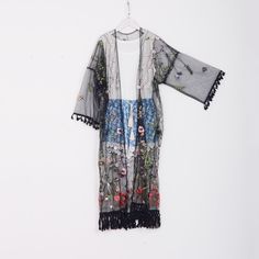 Welcome to my shop, I am in China. It will need around 30 days for international orders. Please consider the time when placing order. Long bohemian kimono,perfect for a casual day out or as a swimsuit cover up. Material: embroidery mesh fabric Size: cuff opening to cuff opening: 55 inches (140cm) cuff width: 10 inches (25cm) chest: 25.5 inches( 65cm) flat length include fringe: 49 inches (125cm) Care: Wash in cold water Hand washing recommended Gentle machine wash Hang to dry Maybe you will like Bohemian Lace Kimono, Long Tasseled Kimono For Spring, Bohemian Long Kimono For Weddings, Long Floral Embroidered Kimono For Wedding, Lace Wedding Kimono With Kimono Sleeves, Spring Kimono With Tassels, Spring Wedding Embroidered Kimono, Spring Wedding Kimono With Floral Embroidery, Cover Up Wedding Dress