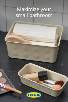 two containers with makeup and brushes in them