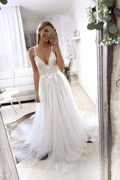 White V-neck Wedding Dress With Sweep Train, White V-neck Dress For Debutante Ball, White V-neck Evening Dress For Prom Season, V-neck Gown With Lace Back For Prom, V-neck Lace Bodice Prom Gown, White V-neck Wedding Dress With Lace Bodice, V-neck Lace Prom Gown, V-neck Wedding Evening Dress With Lace Back, White Prom Gown With Sheer Bodice