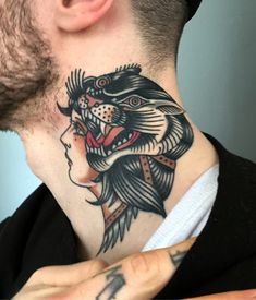 a man with a tiger head tattoo on his neck