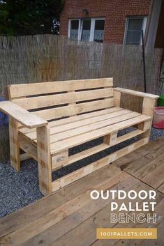 a wooden bench sitting on top of a wooden deck