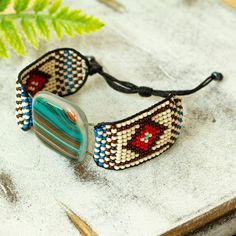 a beaded bracelet with glass beads on it